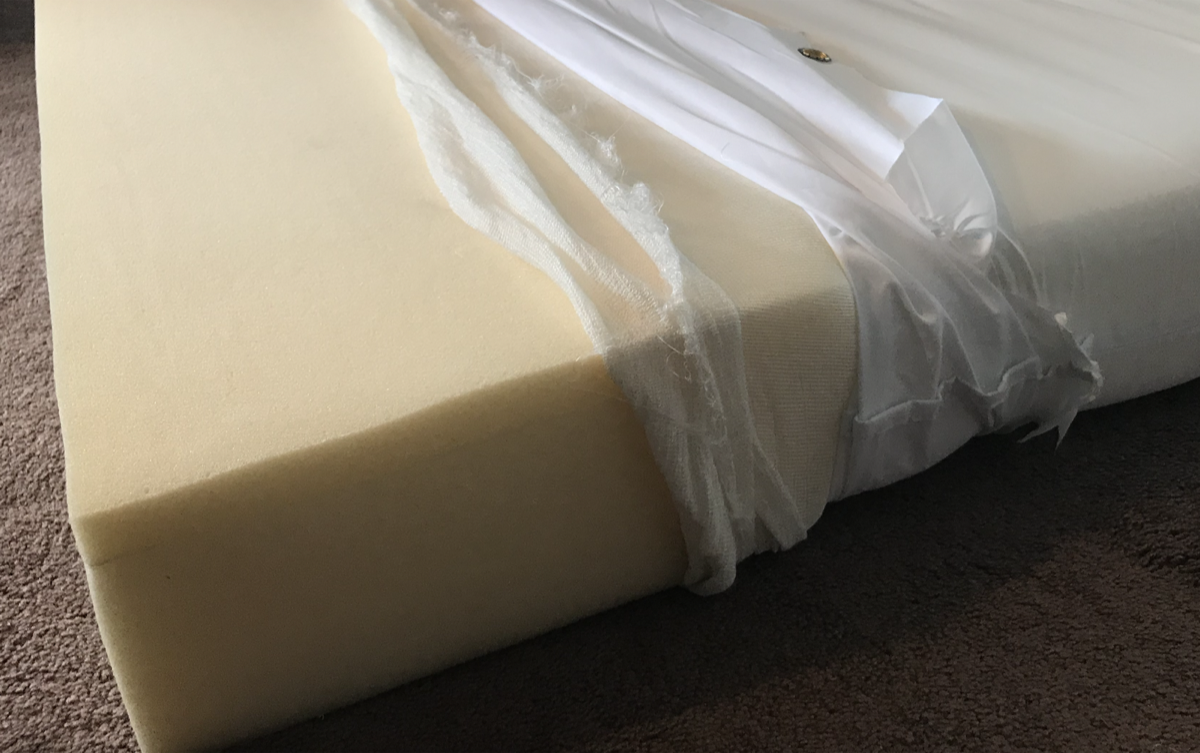 Fiberglass fire barrier on mattress