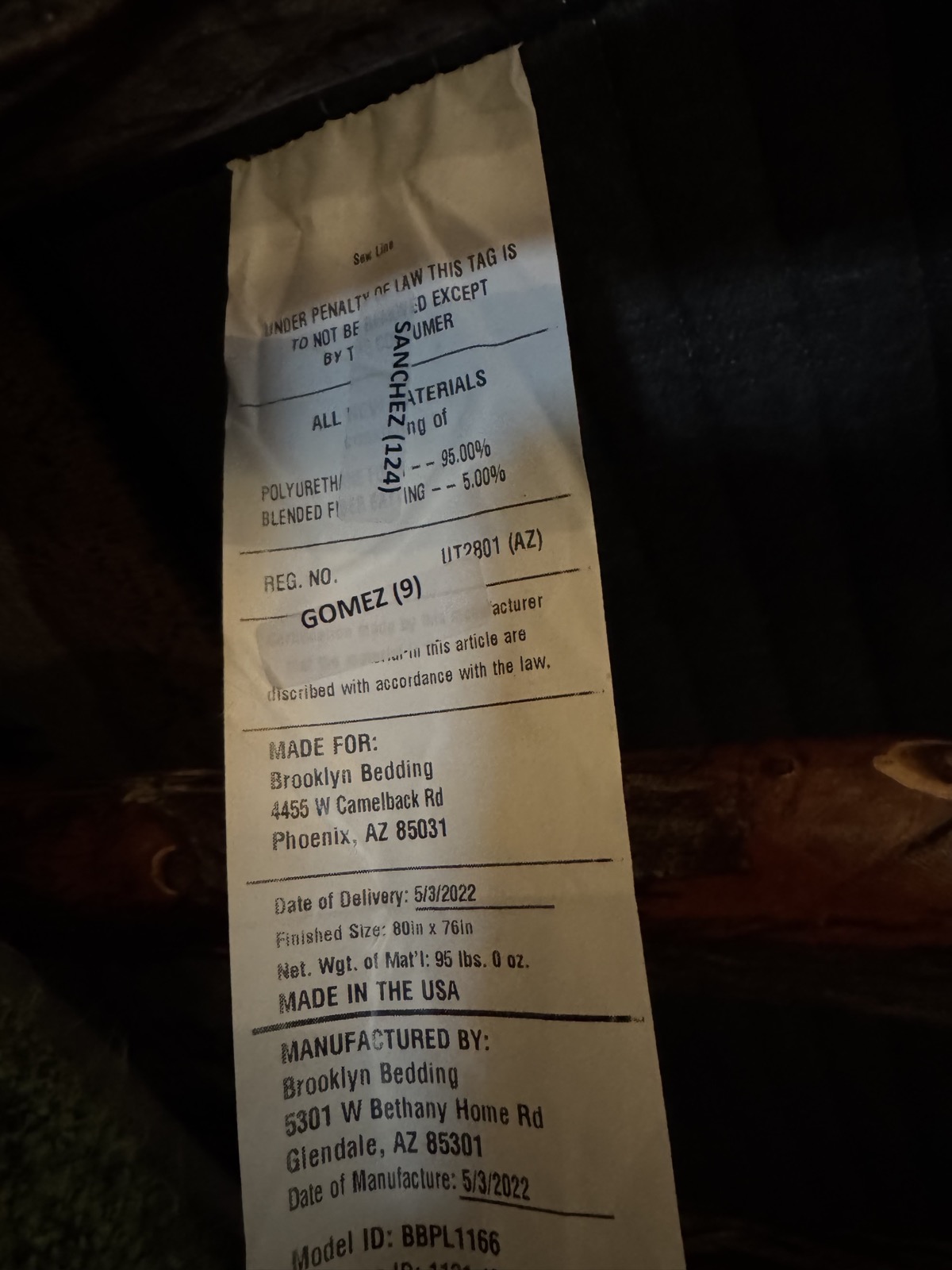 Plank mattress law tag showing May 2022