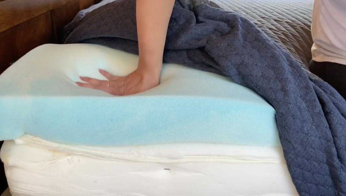 Standing on mattress to test support