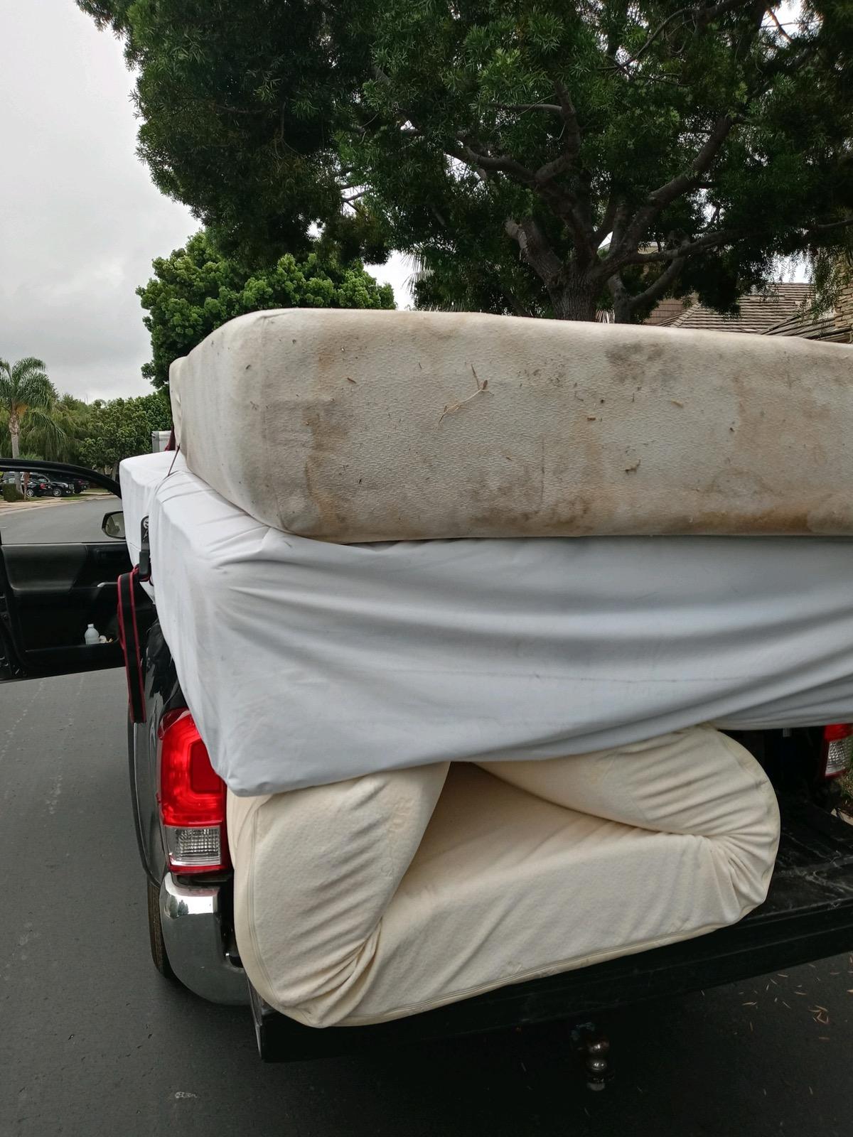 Old worn mattresses in my truck - these are what I pick up every day