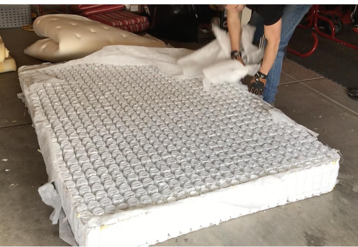 Tearing apart a mattress to inspect materials
