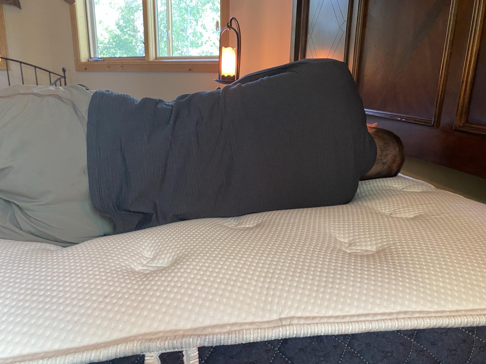 Tim testing a mattress