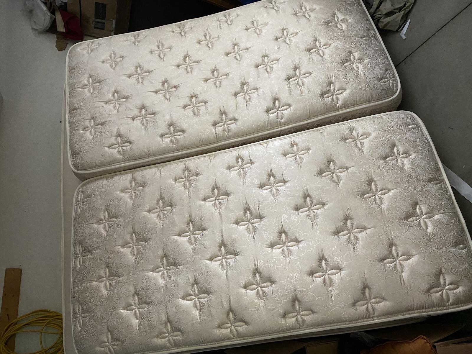 Split mattress being removed by A Bedder World